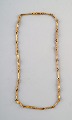 Lapponia halskæde udført i 18 kt. guld. 
