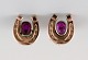 Danish 8K gold ear studs. Mid-1900 s. Horseshoes adorned with purple stones.
