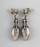 A pair of earrings in sterling silver by Georg Jensen adorned with rose quartz.