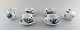 Meissen blue onion. Set of 4 coffee cups and saucers, sugar bowl and creamer. 
Ca. 1920.
