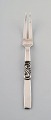 Georg Jensen. Cutlery, Scroll no. 22, hammered Sterling Silver. Meat fork.
