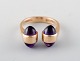 Bernhard Hertz, Danish goldsmith. 14 carat modernist gold ring adorned with 
purple stones.