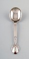 Evald Nielsen number 3, serving spoon in hammered all silver with cabochon coral 
bead. 1920