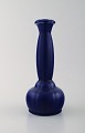Wilhelm Kåge for Gustavsberg. Rare vase with beautiful glaze in deep blue 
shades. Dated 1930.