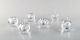 Vicke Lindstrand for Kosta Boda. A collection of six mouth blown perfume bottles 
in clear art glass. Designed in the 1960s.