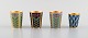 Russian silversmith. Set of 4 Russian vodka cups in gilded silver with enamel 
work. Mid 20th century.
