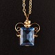 Necklace in 14k gold and pendant with a blue topaz 18k gold