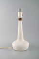 Holmegaard table lamp in white art glass with brass mounting. Danish design, 
1960