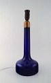 Holmegaard table lamp in dark blue art glass with brass mounting. Danish design, 
1960