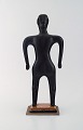 Naivist folk art from Haiti. Standing man on base carved in wood.
Mid 20th century.