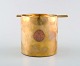 Arne Jacobsen. Large ashtray in brass with copper plaque. "First class only". 
From cruise ship.