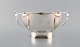 Henry Wilkinson. English silversmith, Sheffield. Modernist silver bowl on foot 
with handles. 1930 / 40