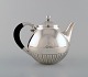 L'Art presents: Johan Rohde for Georg Jensen. "Kosmos" teapot in sterling silver with ebony handle. Design 45A.
