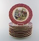 Bohemia "Royal Ivory" decoration plates with romantic motifs on purple 
background with gold garlands. Made in Czechoslovakia. Set of 12  plates. 
1950