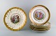Royal Copenhagen porcelain. Six decoration plates and platter with classicist 
scenes. Mid 20th century.
