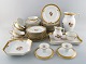 Royal Copenhagen. "Golden basket" tea service in porcelain. Complete for 9 
people.