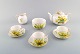 Royal Worchester tea set in hand-painted porcelain. Complete for four people 
with sugar bowl and creamer. Decorated with yellow flowers. 1920 / 30