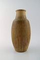 Patrick Nordstrøm for Royal Copenhagen. Large vase in glazed stoneware. 
Beautiful glaze in light earth tones. 1930