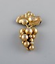 Harald Nielsen for Georg Jensen. Rare and early "Grapes" brooch in gilded 
sterling silver. Dated 1933-44.