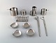 Arne Jacobsen for Stelton. "Cylinda Line" salad set, two ashtrays, sugar bowl, 
condiment set, toast holder and four small dishes in stainless steel. 1970