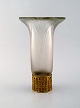Early René Lalique "Lotus" vase in art glass with base of brass. Dated before 
1945.
