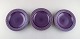 Jens H. Quistgaard for Bing & Grondahl. Three purple "Cordial Palet" soup / 
pasta plates in glazed stoneware. 1960