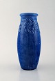 Signe Steffensen for Kähler, HAK. Early and rare vase in glazed stoneware with 
leaves in relief. Beautiful glaze in blue tones. 1920