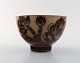 Nils Thorsson for Royal Copenhagen. Jungle series. Bowl in glazed
chamotte clay decorated with palm trees. 1930 / 40