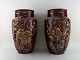 A pair of large Longchamp majolica vases in reddish brown glaze. Birds and 
leaves in gold. 1920