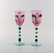 Ulrica Hydman Vallien for Kosta Boda. Two hand painted wine glasses in mouth 
blown art glass. 1980