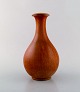 Gunnar Nylund for Rörstrand. Vase in glazed stoneware. Beautiful glaze in red 
brown shades. 1960