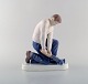 Bing & Grondahl porcelain figurine. Plumber. Model Number: 2432.
Measures: 22 x 19 cm.
