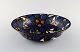 Kähler, HAK, glazed ceramic bowl in modern design. 1930 / 40s. Blue flowers on 
cream background.