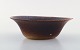 Gunnar Nylund for Rörstrand. Bowl in glazed ceramics. Beautiful glaze in brown 
shades. Mid 20th century.