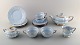 Arthur Percy for Upsala-Ekeby / Gefle. Set of four Art Deco "Grand" teacups with 
saucer, teapot, sugar / cream set and four plates in pastel blue porcelain 
plates with hand-painted gold border. 1930 / 40