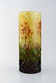 Large and impressive Daum Nancy art nouveau vase in mouth blown enamelled art 
glass. Acid-etched glass. Hand painted red flowers and branches in relief. Early 
20th century
