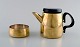 Henning Koppel (1918-81) for Georg Jensen, design 7002.
Coffee pot and sugar bowl in brass.