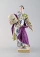 Meissen porcelain figurine. Woman in dress with branches. Ca. 1900.
