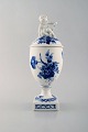 Royal Copenhagen. Blue flower lidded trophy. Small boy with mirror.
Decoration number 10/1754.