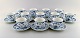 12 Royal Copenhagen Blue Fluted Half Lace Coffee cups with saucers.

