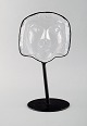 Erik Höglund for Kosta Boda, face shaped sculpture in art glass with stands in 
wrought iron. 1970