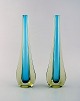 A pair of Murano vases in light blue and smoke colored, mouth blown art glass. 
1960