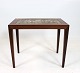 Side table of rosewood and brown tiles from Royal Copenhagen, by Severin Hansen 
for Haslev Furniture Factory from the 1960s. 
5000m2 showroom.