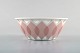 Bjørn Wiinblad for Rosenthal. "Lotus" porcelænservice. Gennembrudt skål 
dekoreret med lyserøde lotusblade. 1980