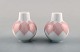 Bjørn Wiinblad for Rosenthal. "Lotus" porcelain service. Salt / pepper set 
decorated with pink lotus leaves. 1980