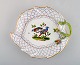Antique hand painted Meissen leaf shaped dish with bird motif and repousse 
flowers. Mid 19th century.
