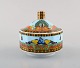 Gianni Versace for Rosenthal. "Le voyage de Marco Polo" porcelain sugar bowl 
with gold decoration and peacock motif. Late 20th century.
