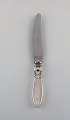 Georg Jensen "Cactus" dinner knife in sterling silver and stainless steel. Dated 
1915-30.
