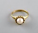 Scandinavian jeweler. 8 carat gold ring adorned with cultured pearl. 1930 / 
40