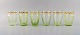 Emile Gallé (1846-1904). Seks tidlige og sjældne glas i mundblæst lysegrønt 
kunstglas med håndmalede guldekorationer i form af blade. Museumskvalitet, 
1870/80